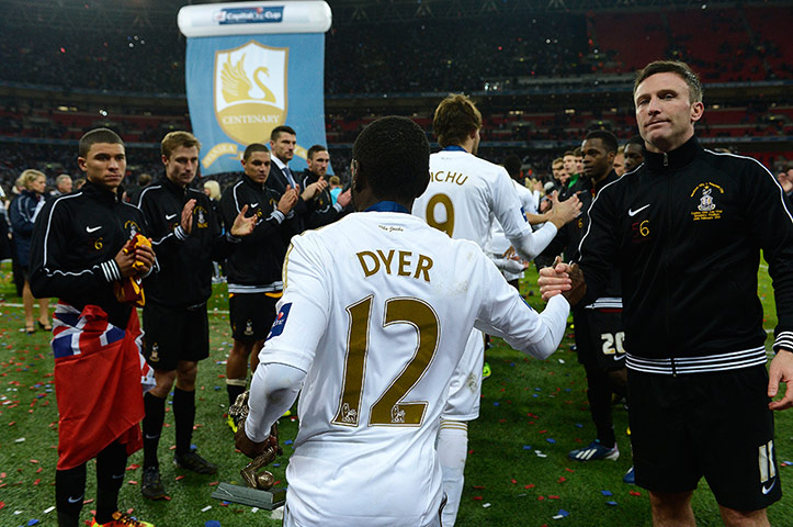 Capital One Final 7: The guard of honour is returned to Swansea by the Bradford players 