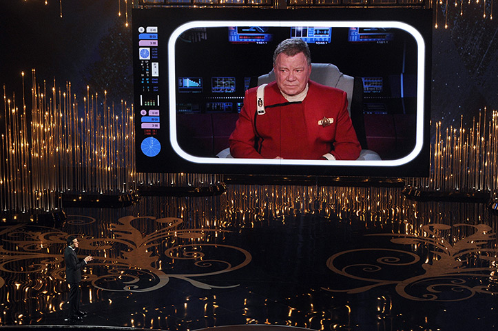 Oscar Ceremony 2013: Host Seth MacFarlane talks to actor William Shatner on the video screen 