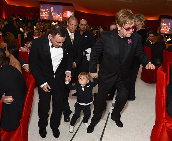 Oscars after party: David Furnish and Elton John bring Zachary along to the party