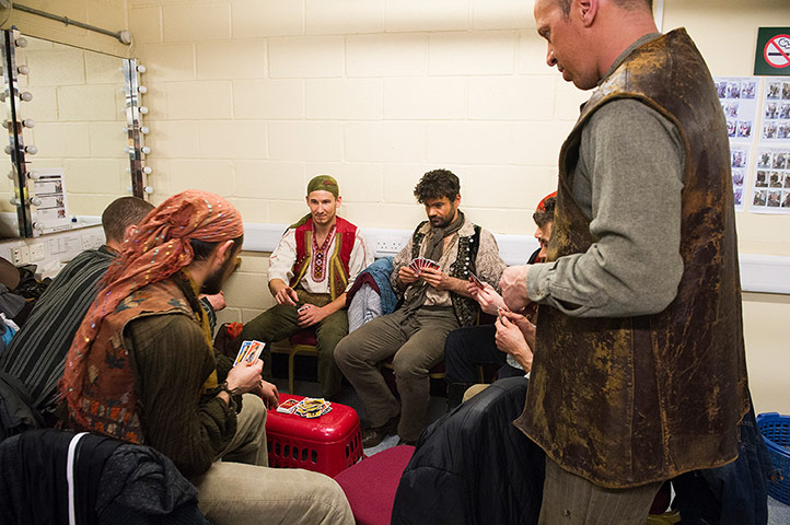 Carmen: Members of the Chorus play cards during the interval 