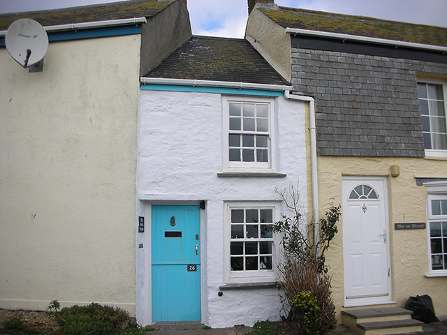 Your Pics - Squeeze: narrow house with blue door in between houses