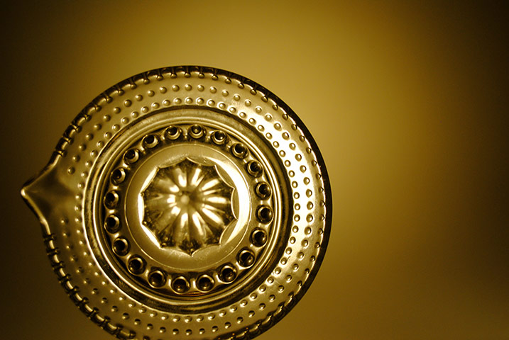 Your Pics - Squeeze: lemon squeezer against gold background