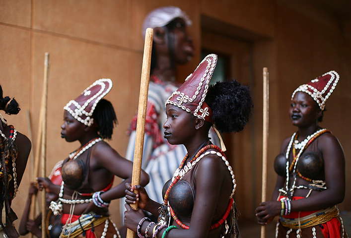 FTA: Nic Bothma: Performers wearing traditional costumes watch the opening