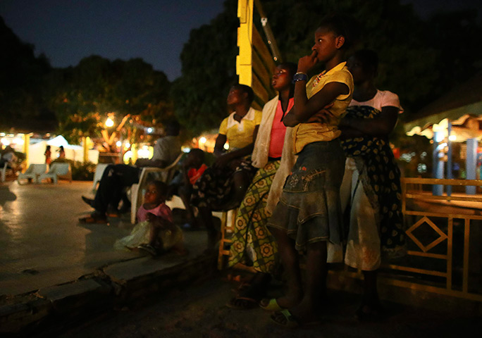 FTA: Nic Bothma: Girls watch an outdoor film screening 