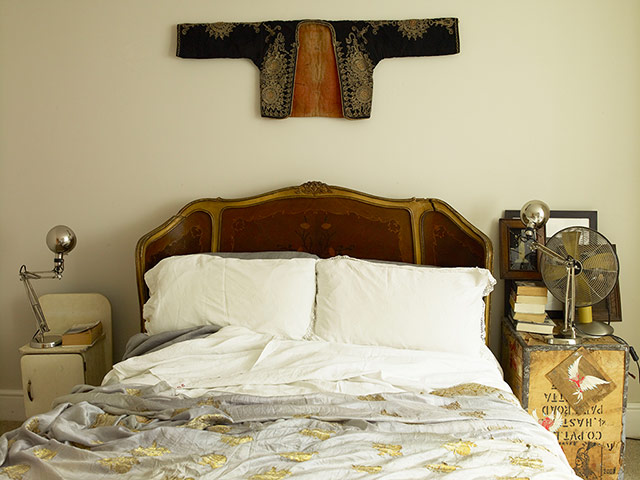 Homes - Economy Class: shot of bed with oriental jacket hanging above