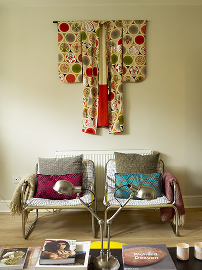 Homes - Economy Class: shot of two chairs with kimono hanging above