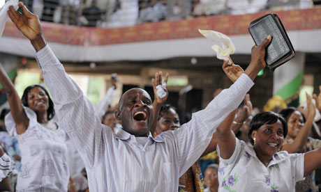 Worshippers raise their hands during worship service at the Pure Fire Miracle Church in Accra, Ghana