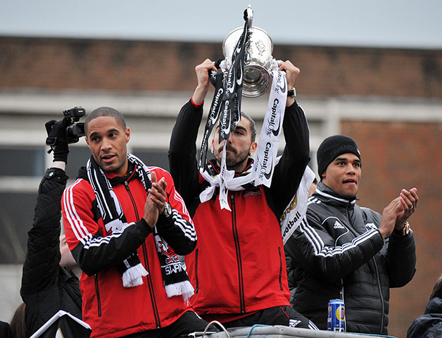 Swansea parade: Ashley Williams, left, Michael Vorm, right, and Chico Flores
