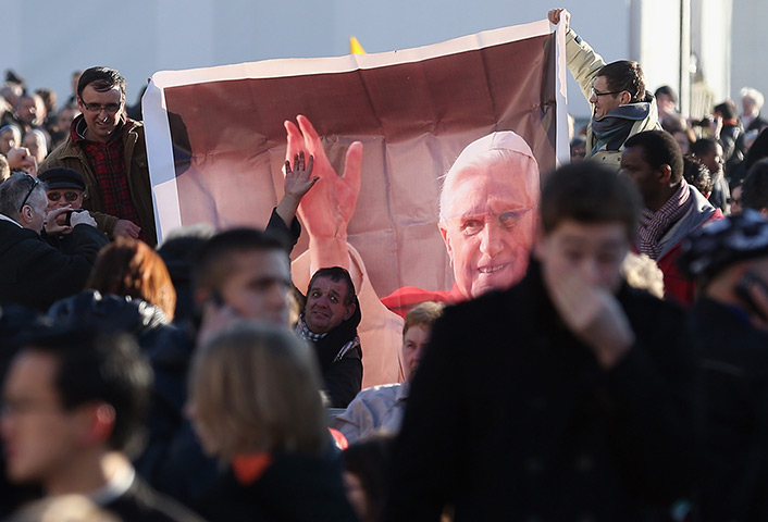 Pope Benedict XVI update: Pilgrims hold a banner of  Pope Benedict XVI