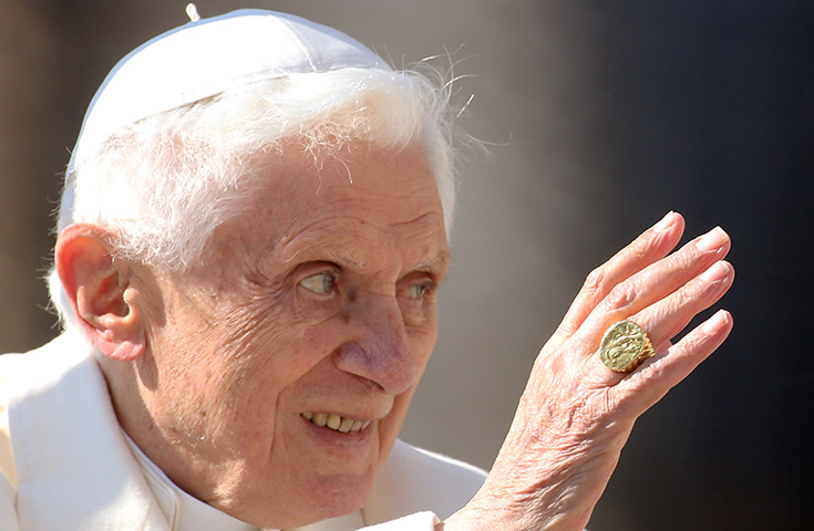 Pope Benedict XVI update: Pope Benedict XVI waves to the faithful as he leaves St Peter's Square