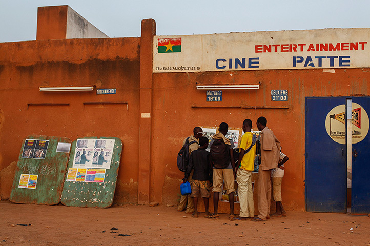 FTA: Nic Bothma: Schoolboys look at film posters outside the open-air Cinema Patte d’Oie