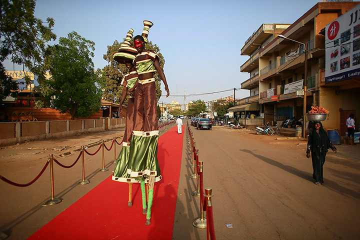 FTA: Nic Bothma: Performers rehearsing on the red carpet outside Cinema Burkina