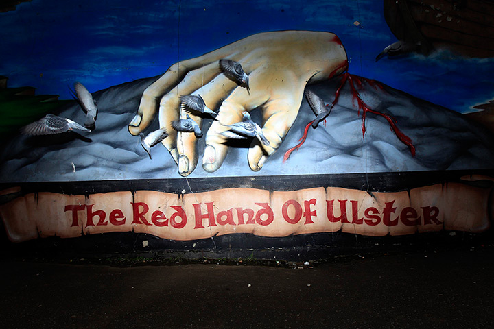 24 hours in pictures: Pigeons fly past a mural in the Shankill Road area of West Belfast