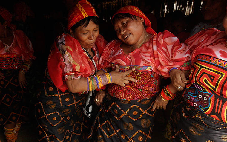 24 hours in pictures: Women drinking a beverage called Chicha during anniversary celebrations