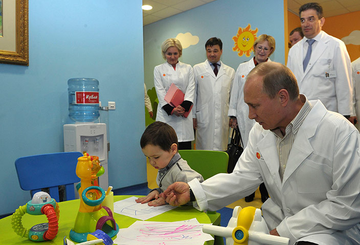 A lighter look: Russia's President Putin visits Lapino clinical hospital in Lapino