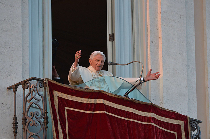 The Pope's last day: Pope Benedict XVI waves to faithful from a balcony in Castel Gandolfo