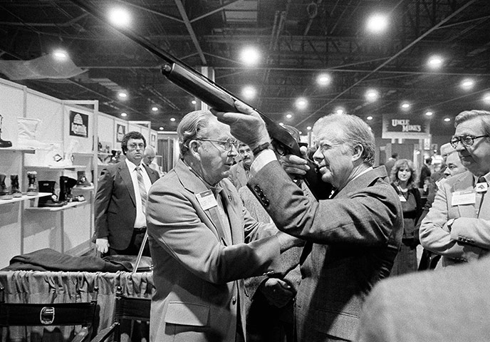 US presidents with guns: Jimmy Carter looks down the barrel of a shotgun in Atlanta