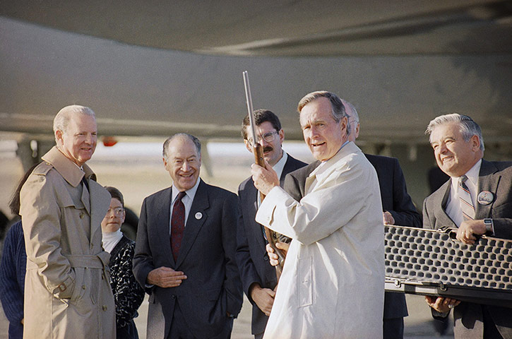 US presidents with guns: George H. Bush displays a rifle given to him as a gift, in Billings