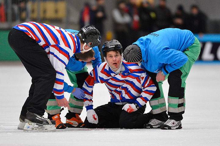 24 hours: Vanersborg, Sweden: Injured referee Kuusela is helped off the ice 