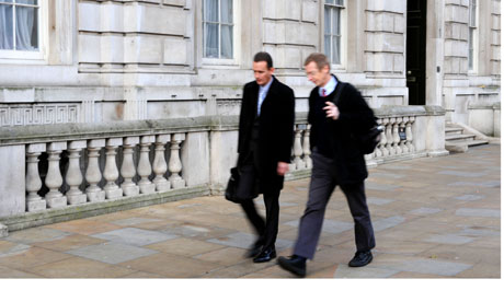 People going to work in traditional clothing, who may be civil servants