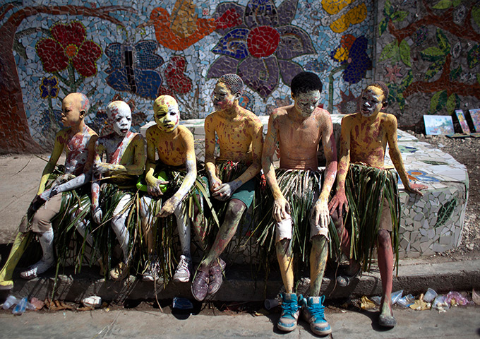 24 hours: Jacmel, Haiti: Participants wait for carnival celebrations