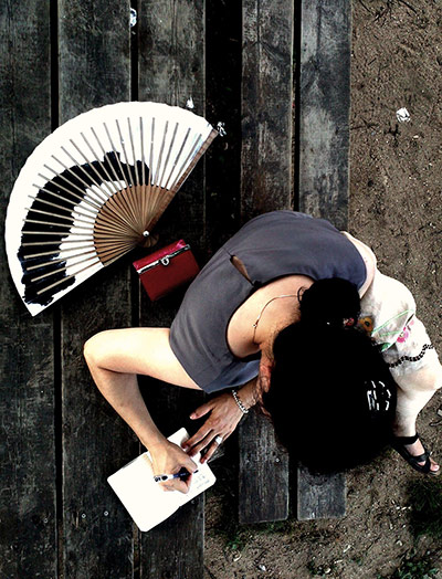 Your Pictures: Love: Overhead shot of woman writing on a notepad