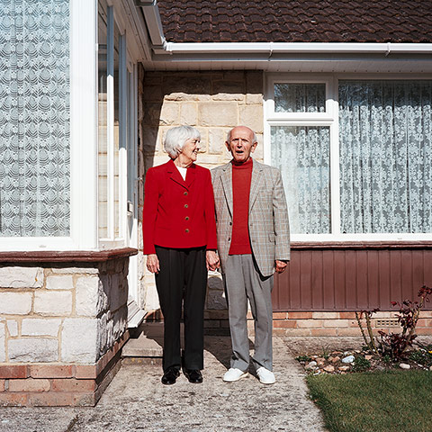 Your Pictures: Love: Old man and woman standing outside their home 