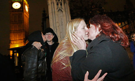 Elizabeth Maddison kisses her civil partner Hannah Pearson in front of parliament