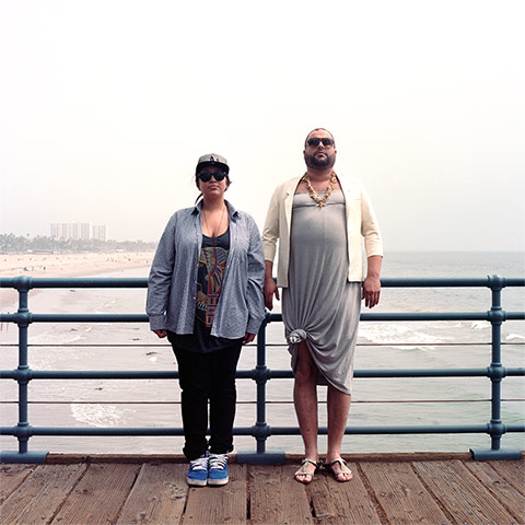 Big Picture - Hana Pesut: couples clothes swapping hana pesut switcheroo woman wearing grey shirt black t-shirt and jeans man wearing grey dress necklace and flip-flops