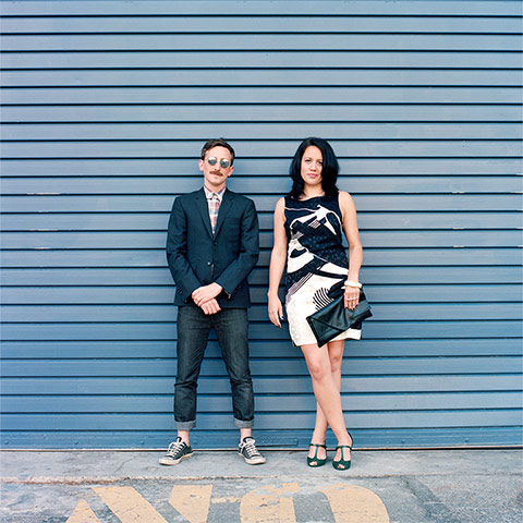 Big Picture - Hana Pesut: couple clothes swapping hana pesut switcheroo man wearing blue blazer and jeans woman wearing black and cream dress