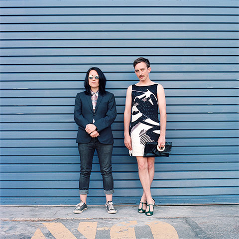 Big Picture - Hana Pesut: couple clothes swapping hana pesut switcheroo woman wearing jeans and blazer man wearing black and cream dress and heels