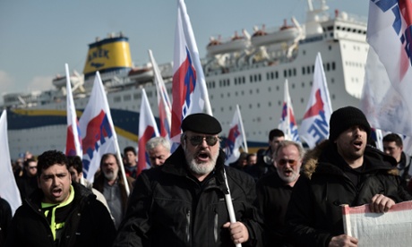 Members of the Greek comunist labour union demonstrate at the Greece's main harbour Piraeus port on February 6, 2013 in Athens during the forced end to a strike movement by seamen.
