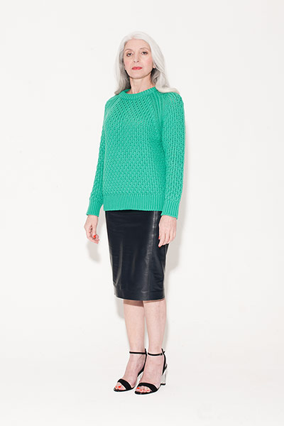 All ages - leather: Woman in green jumper and leather skirt
