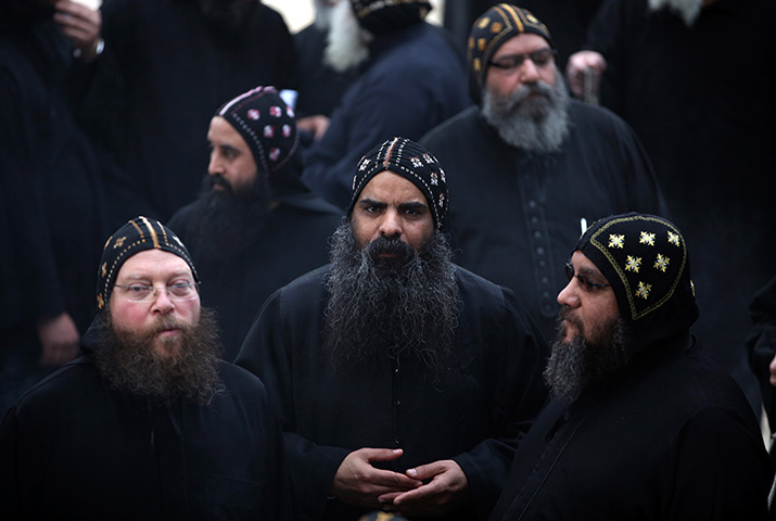 24 hours in pictures: Clergymen gather to wait for the arrival of Egypt's Coptic Christian pope