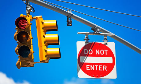 Traffic light and Do Not Enter sign on pole