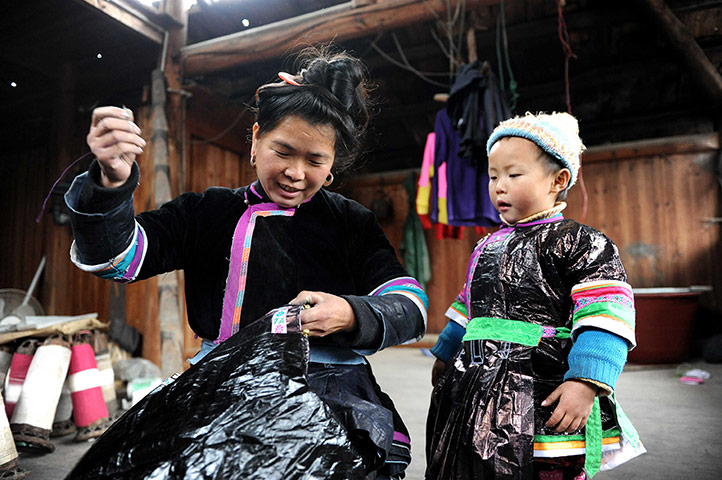 24 Hours: Kaili, China: Dong women make clothes with handmade cloth