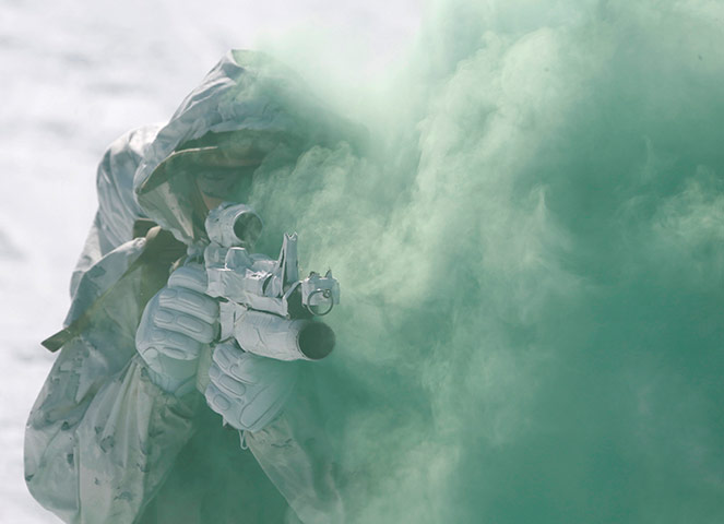 24 Hours: Pyeongchang, South Korea: A US Marine attends a winter military drill