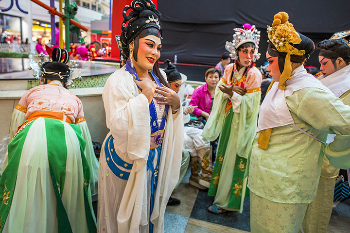 Lunar New Year: Chinese opera performers wait to go on stage for a New Year performance at Seacon Square in Bangkok, Thailand