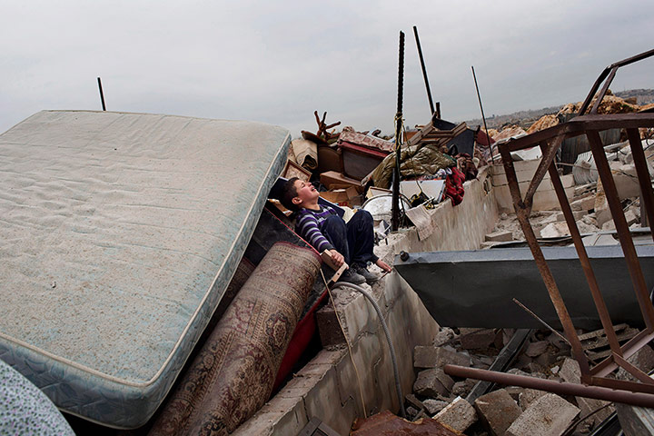 20 Photos: Palestinian child after his house was demolished in Beit Hanina, Jerusalem