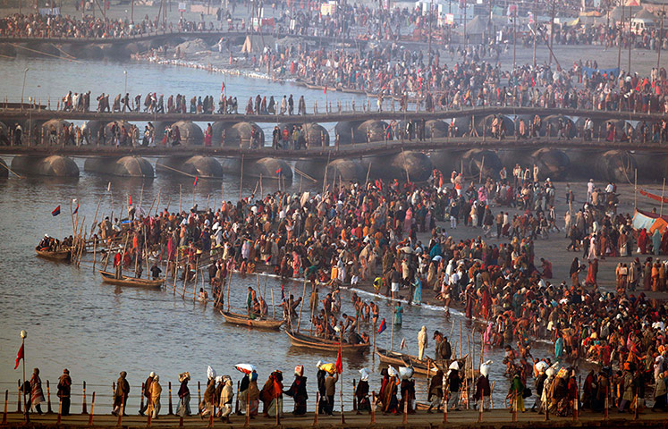 24 hours: Indian devotees arrive for a holy dip at Sangam in Allahabad, India