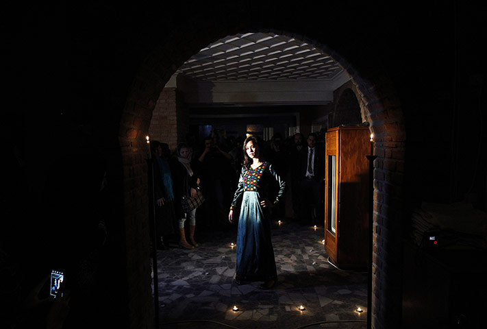 24 hours: A model presents an Afghan traditional dress at a fashion show