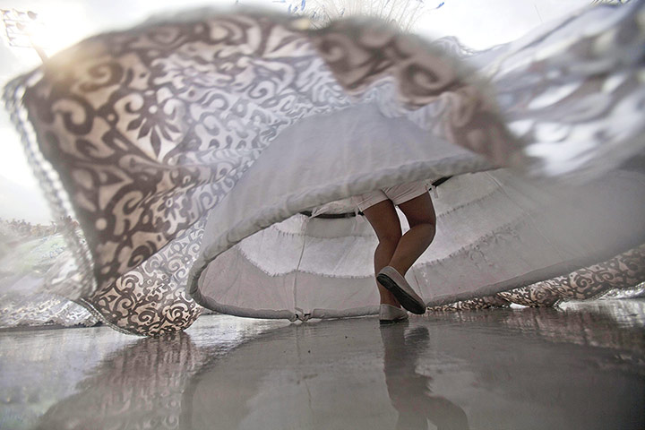 Carnival: A dancer from the samba school Aguila de Ouro 