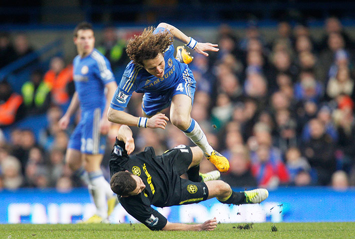 Saturday Prem matches: Chelsea's David Luiz is fouled by Wigan Athletic's James McArthur 