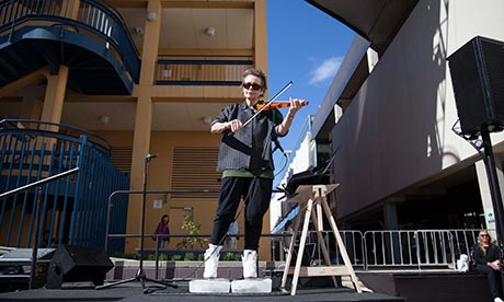 Laurie Anderson performs Duets on Ice outside the Samstag Museum of Art