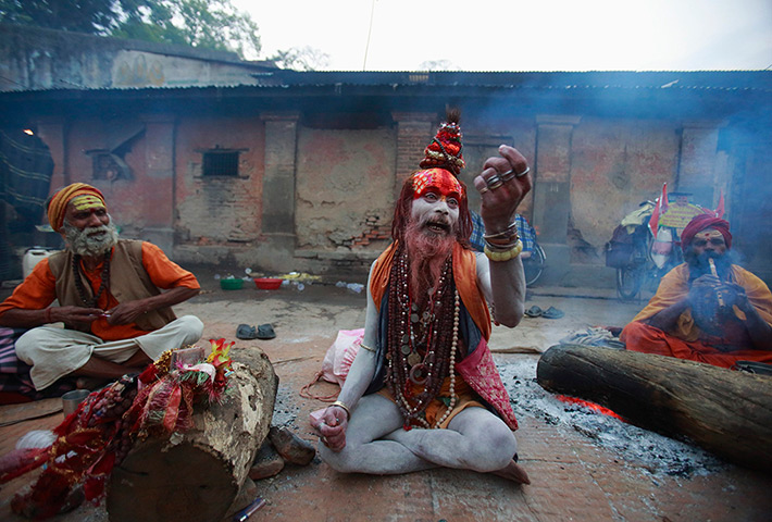 24 hours: Kathmandu, Nepal: A sadhu (Hindu holy man) asks for money