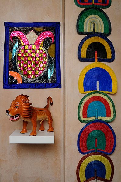 Homes - moroccan home: brightly coloured fans and tiger ornament