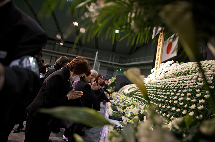 24 hours in pictures: Japan Marks 2nd Anniversary