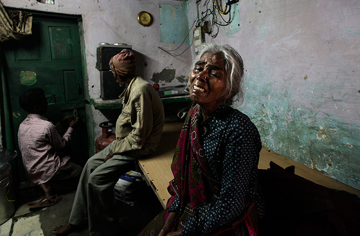 24 hours in pictures: The mother of Ram Singh, cries as she speaks to journalists