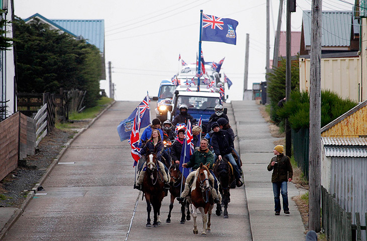 Falkland Islands: Falkland islanders lead a parade on their horses