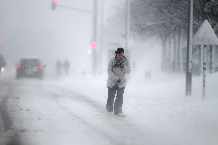 Europe snow: A woman walks in a snowstorm in Caen